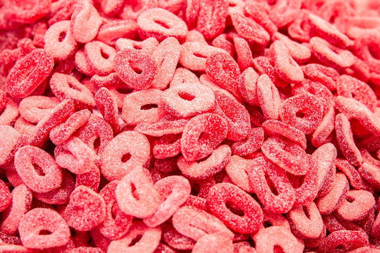 A bunch of bright red spicy peach rings.