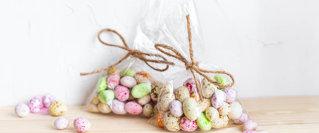 Wrapped bags of candy against a neutral background. 