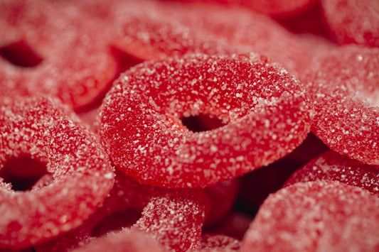Close-up view of red sugar-raised gummy rings 